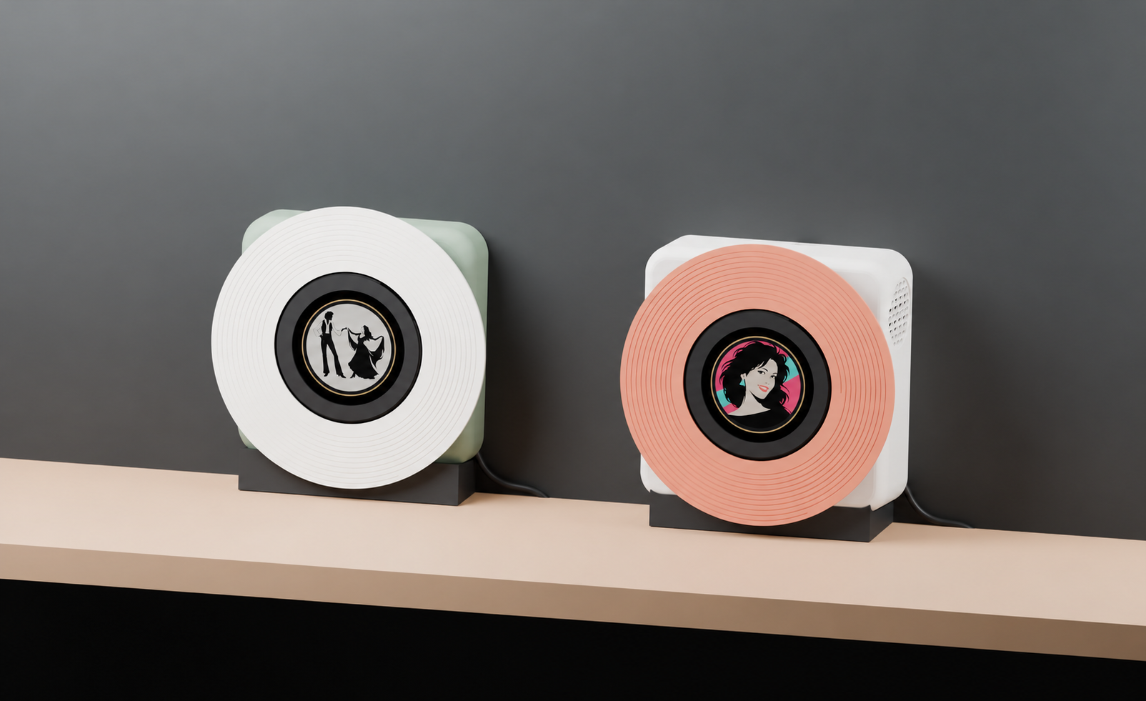 SPNDL-QT on the left and SPNDL+ on the right, each standing on its own black H1 clip-on heel, with space between them on a wide shelf and a separate USB-C power cable routed behind each model